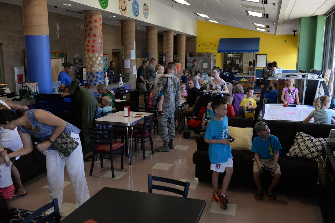 Families from Sheppard Air Force Base, Texas, played games, and ate food at the summer family picnic on July 20, 2016. The summer family picnic had several booths from various helping agencies to help welcome and introduce new families to what the base has to offer. (U.S. Air Force photo by Senior Airman Kyle E. Gese/Released)