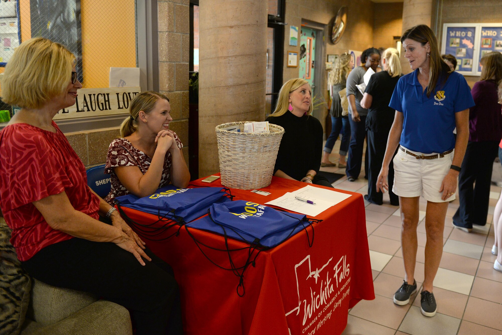 Dee Dee Doherty, wife of Brig. Gen. Patrick Doherty, 82nd Training Wing commander, talks with members of the Wichita Falls Chamber of Commerce during the summer family picnic at Sheppard Air Force Base, Texas, July 20, 2016. The summer family picnic had several booths from various helping agencies to welcome and introduce new families to the base. (U.S. Air Force photo by Senior Airman Kyle E. Gese/Released)