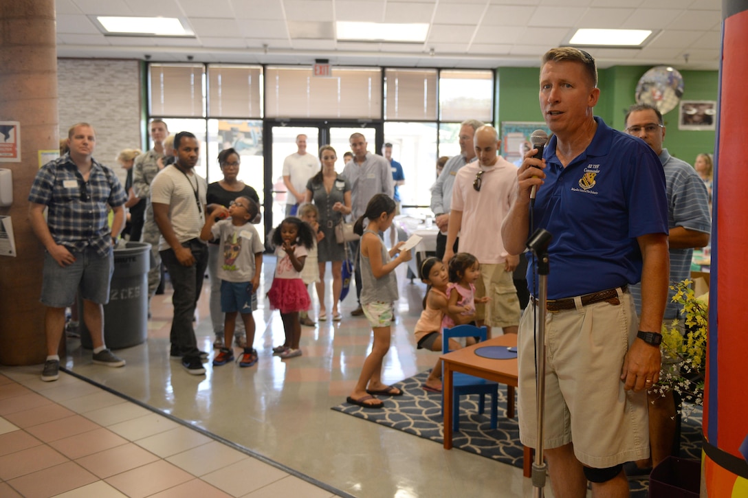 Brig. Gen. Patrick Doherty, 82nd Training Wing commander, welcomes new families to Sheppard Air Force Base, Texas, during the summer picnic, July 20, 2016. The picnic hosted several base helping agencies to welcome new families to the base and community. (U.S. Air Force photo by Senior Airman Kyle E. Gese/Released)