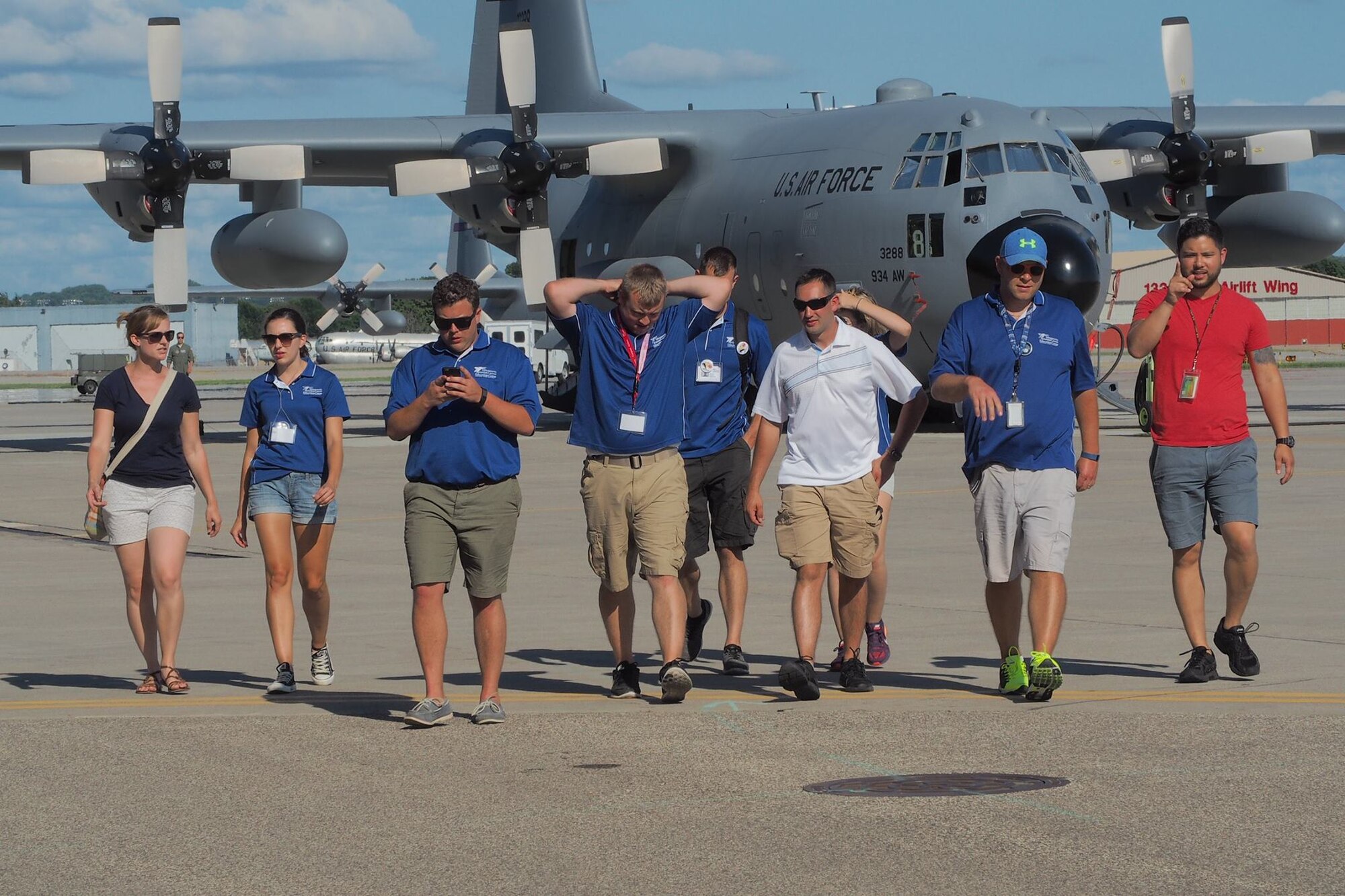 Aviation Career Education (ACE) Camp counselors walk off the flight line after a tour of a 934th Airlift Wing C-130 July 19.