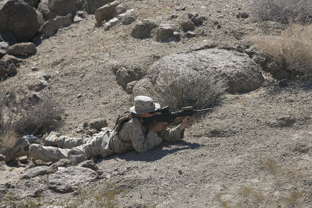 Cpl. Trent Maxell, teamleader, 3rd Battalion, 4th Marines, 7th Marine Regiment, sights in during an immediate action practical application exercise held as part of the Tactical Small Unit Leaders’ Course aboard Marine Corps Air Ground Combat Center, Twentynine Palms, Calif., July 14, 2016. (Official Marine Corps photo by Cpl. Thomas Mudd/Released)