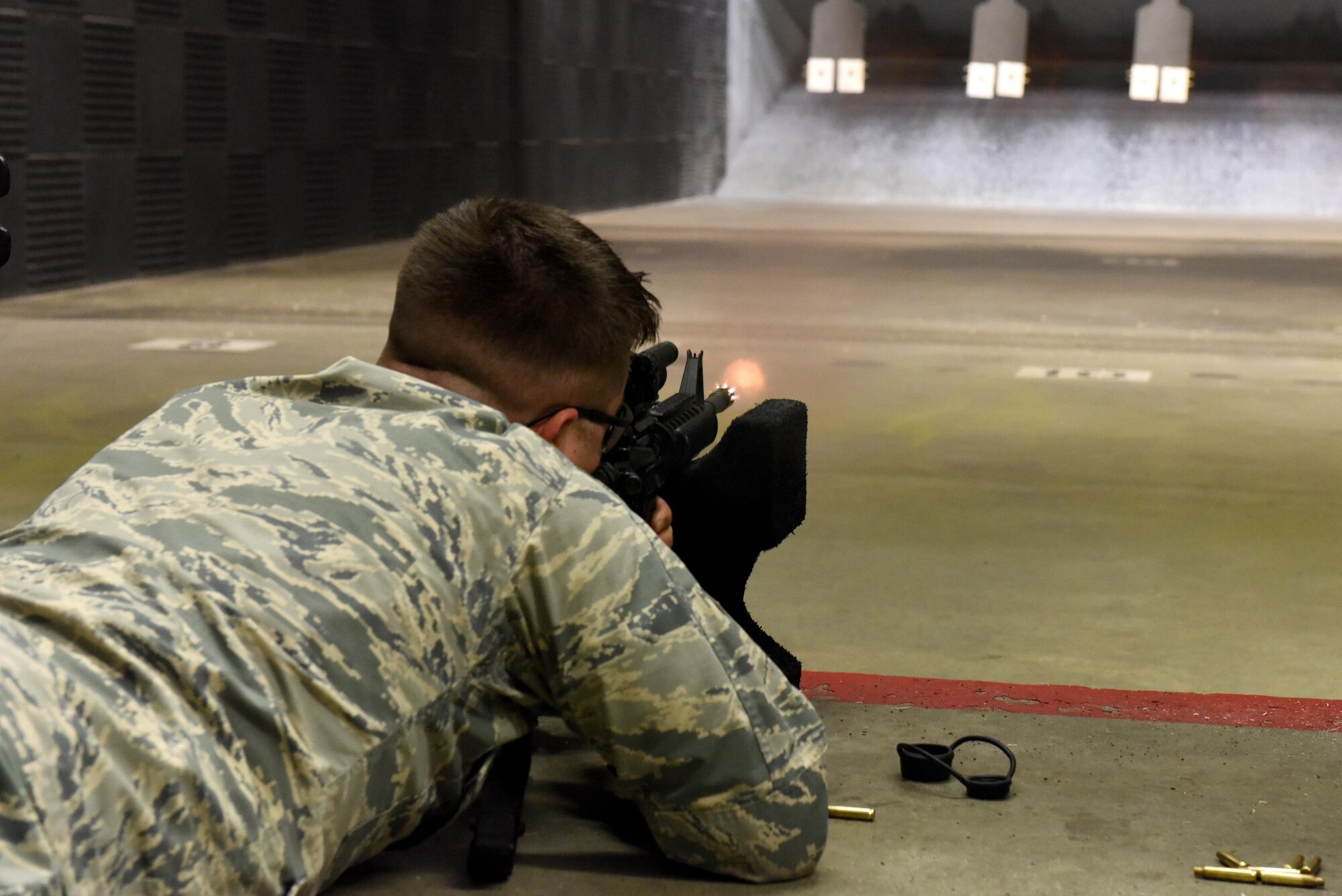 Airman 1st Class Andrew Fonke, 4th Logistics Readiness Squadron fleet management and analysis specialist, fires practice rounds during a Combat Arms Training and Maintenance class July 22, 2016, at Seymour Johnson Air Force Base, North Carolina. CATM classes are two-days long and consist of battle drills, basic fundamentals, and analyzing different weapons. (U.S. Air Force photo by Airman Miranda A. Loera)