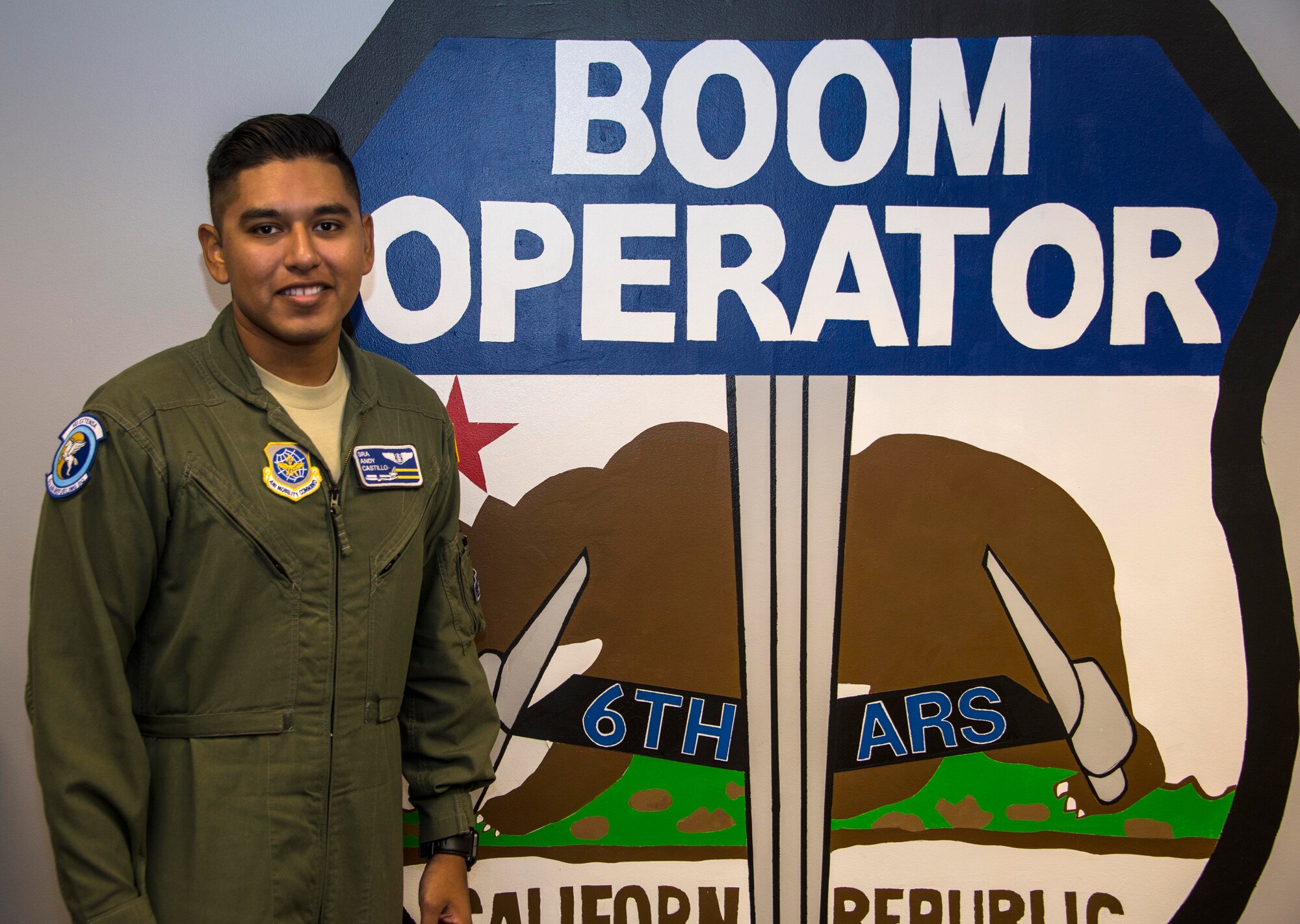 Senior Airman Andres Castillo, 6th Air Refueling Squadron boom operator, poses for a photo within his squadron at Travis Air Force Base, Calif., July 20, 2016. (U.S. Air Force photo by Staff Sgt. Charles Rivezzo)