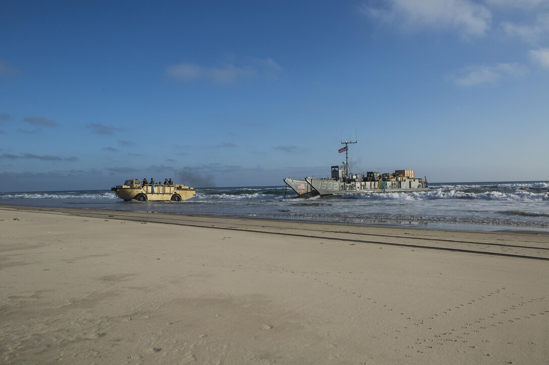 MARINE CORPS BASE CAMP PENDLETON, Calif. - Sailors from the Makin Island Amphibious Ready Group unload a landing craft, utility at Camp Pendleton July 19, 2016. The LCU launched from the USS Comstock (LSD 45) and carried a Beach Master Unit’s equipment and a combined anti-armor team from the 11th Marine Expeditionary Unit to shore. This gave the LCUs practice landing in the surf and transporting equipment from ship to shore. (U.S. Marine Corps photo by Sgt. Anna Albrecht/Released)