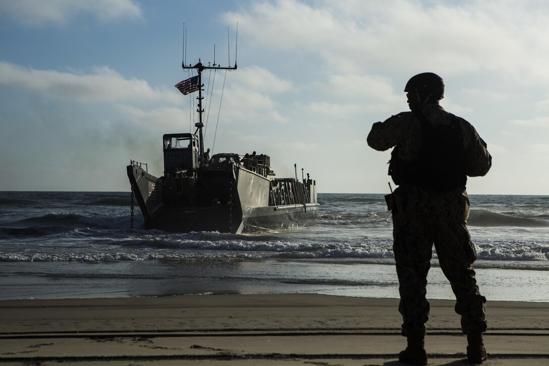 MARINE CORPS BASE CAMP PENDLETON, Calif. -  Sailors from the Makin Island Amphibious Ready Group approach the shore in a landing craft, utility at Camp Pendleton July 19, 2016. The LCU launched from the USS Comstock (LSD 45) and carried a Beach Master Unit’s equipment and a combined anti-armor team from the 11th Marine Expeditionary Unit to shore. The 11th MEU and Amphibious Squadron 5 are working together in preparation for their upcoming Western Pacific deployment 16-2. (U.S. Marine Corps photo by Sgt. Anna Albrecht/ Released)