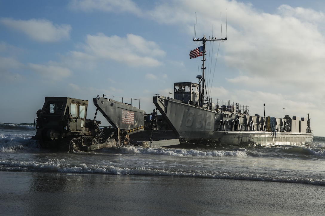 MARINE CORPS BASE CAMP PENDLETON, Calif. -  Sailors from the Makin Island Amphibious Ready Group unload a landing craft, utility at Camp Pendleton July 19, 2016. The LCU launched from the USS Comstock (LSD 45) and carried a Beach Master Unit’s equipment and a combined anti-armor team from the 11th Marine Expeditionary Unit to shore. Amphibious Squadron 5 and the 11th MEU are working together to prepare for their upcoming deployment later this year. (U.S. Marine Corps photo by Sgt. Anna Albrecht/ Released)