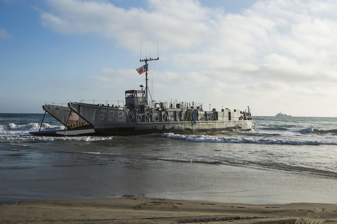 MARINE CORPS BASE CAMP PENDLETON, Calif. -  Sailors from the Makin Island Amphibious Ready Group approach the shore in a landing craft, utility at Camp Pendleton July 19, 2016. The LCU launched from the USS Comstock (LSD 45) and carried a Beach Master Unit’s equipment and a combined anti-armor team from the 11th Marine Expeditionary Unit to shore. This gave the LCUs practice landing in the surf and transporting equipment from ship to shore. (U.S. Marine Corps photo by Sgt. Anna Albrecht/Released)