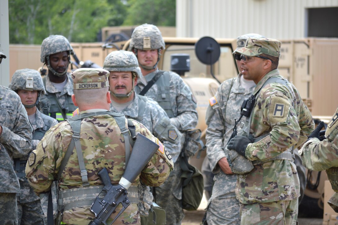 Army Reserve Sgt. 1st Class Joshua Hintz, 1351st Brigade Support Battalion OC/T 181 Infantry Brigade, speaks with Soldiers after exercise on there performance during Warrior Exercise (WAREX) 86-16-03 at Fort McCoy, Wis., July 18, 2016. WAREX is designed to keep Soldiers all across the United States ready to deploy. (U.S. Army photo by Thomas Watters/Released)