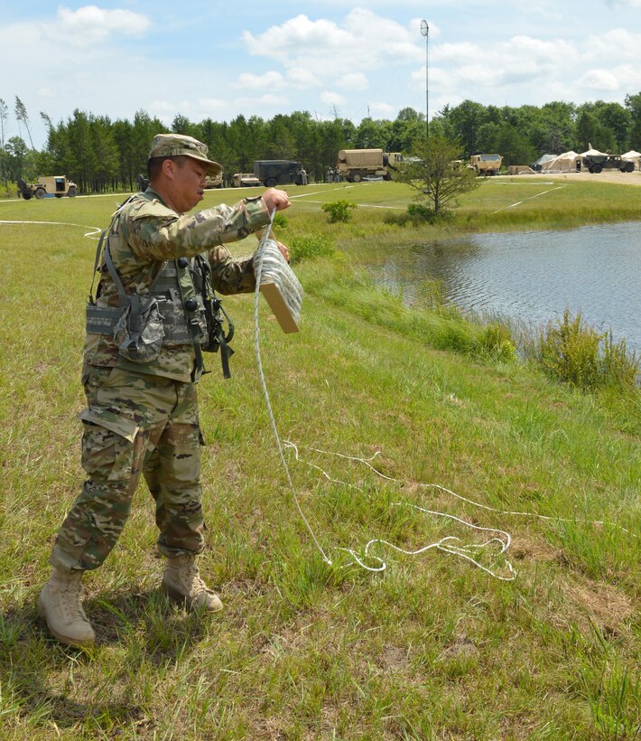 Army Reserve Sgt. John Mooc, of 968th Quartermaster, Tustin, Ca., rewindes anchor chord during Warrior Exercise (WAREX) 86-16-03 at Fort McCoy, Wis., July 19, 2016.  WAREX is designed to keep Soldiers all across the United States ready to deploy. (U.S. Army photo by Spc. Joseph Driver/Released)Army; Annual Training; Reserves; Warrior Exercise; WAREX; Ft. McCoy