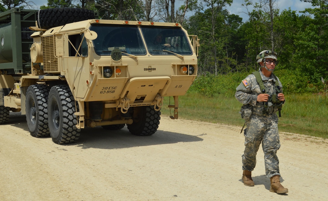 Army Reserve Sgt. Yun Nam, of 968th Quartermaster, from Tustin, Ca., guides a M978 A4 HEMTT water truck during Warrior Exercise (WAREX) 86-16-03 at Fort McCoy, Wis., July 19, 2016. WAREX is designed to keep Soldiers all across the United States ready to deploy.  (U.S. Army photo by Spc. Joseph Driver/Released)