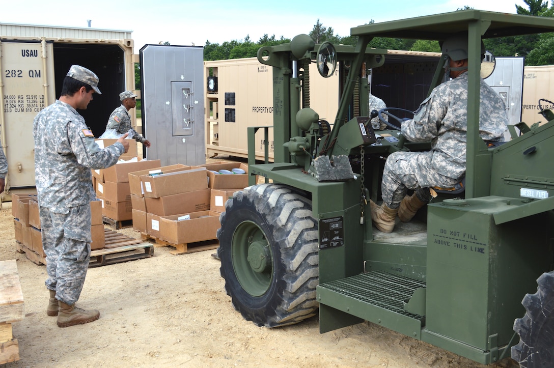 Army Reserve Spc. William H. Darden, 282nd Quartermaster, Montgomery, Alabama, directs a forklift to pick up a load of supplies during Warrior Exercise (WAREX) 86-16-03 at Fort McCoy, Wis., July 18, 2016. WAREX is designed to keep Soldiers all across the United States ready to deploy.