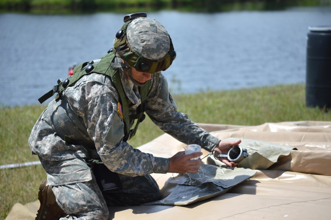 Army Reserve Spc. Daniel L. Leone, of 968th Quartermaster, Tustin, California, takes samples of water to test for potability during Warrior Exercise (WAREX) 86-16-03 at Fort McCoy, Wis., July 18, 2016. WAREX is designed to keep Soldiers all across the United States ready to deploy.