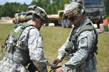 Army Reserve Spc. Daniel L. Leone, 968th Quartermaster Company, Tustin, California, fills a Soldier's camelback with fresh water during Warrior Exercise (WAREX) 86-16-03 at Fort McCoy, Wis., July 18, 2016. WAREX is designed to keep Soldiers all across the United States ready to deploy.