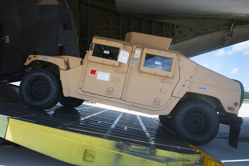 A member of the 305th Aerial Port Squadron drives a six-ton Humvee into a C-5 Super Galaxy at Joint Base McGuire-Dix-Lakehurst, N.J., July 21, 2016. Fifty Humvees will be loaded onto five C-5s and transported to Iraq in support of Operation Inherent Resolve as part of the Secretary of Defense Ashton Carter’s recent directive. 