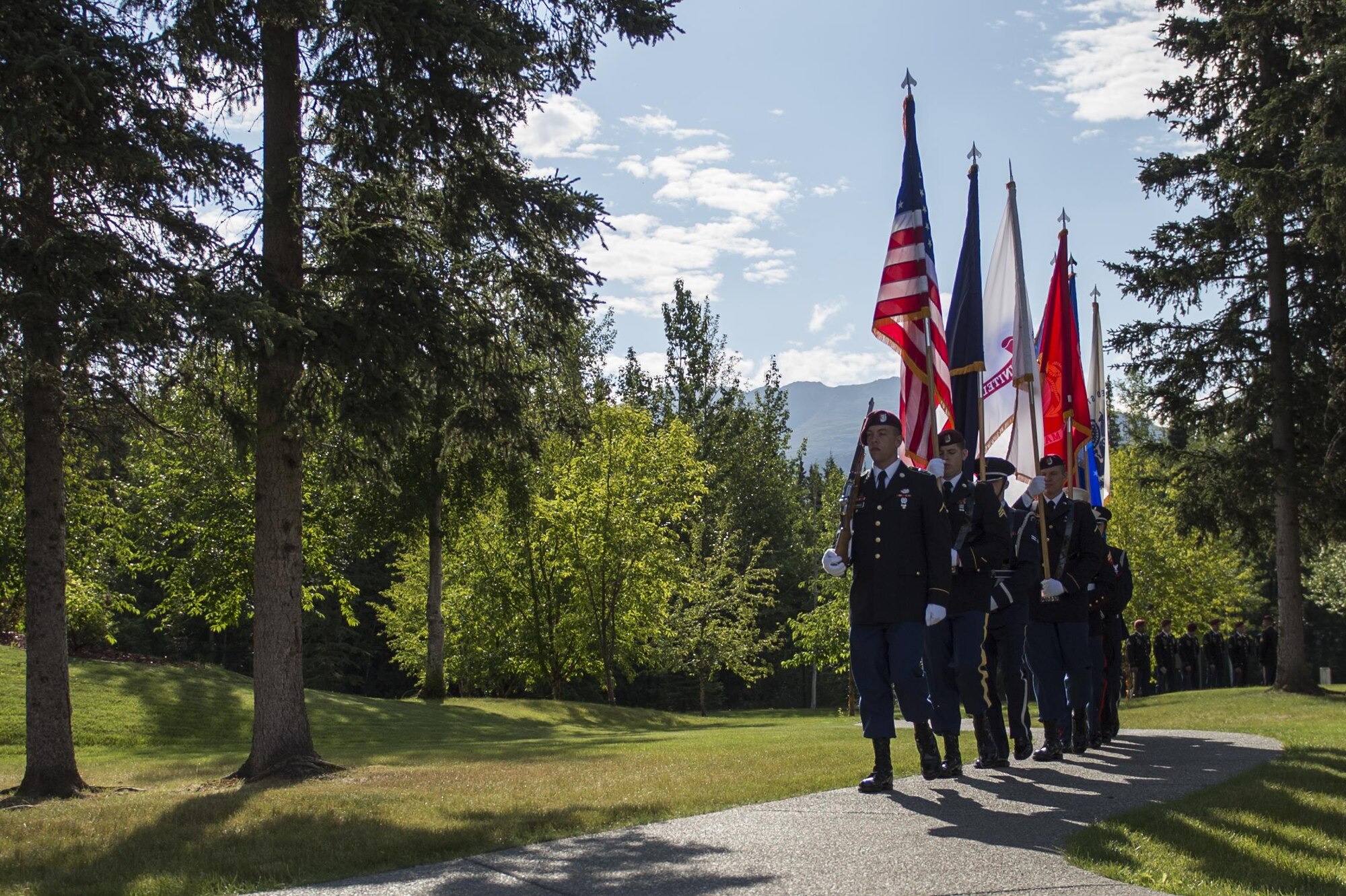 Joint Base Elmendorf-Richardson's Joint Color Guard presents the colors during the Gold Star Wives of America memorial ceremony at the Fort Richardson National Cemetery, July 15, 2016 on Joint Base Elmendorf-Richardson, Alaska.  The memorial ceremony was a part of the Gold Star Wives of America's annual convention hosted this year in Anchorage, Alaska. 