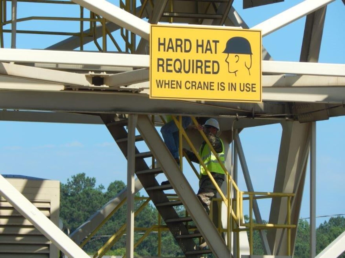 Army Brig. Gen. John Laskodi, DLA Distribution commander, ascends the only DoD-owned 80-ton heavy lift crane, known as "Clyde," at DLA Distribution Anniston, Ala.  The crane is used for loading and unloading tracked vehicles and artillery.