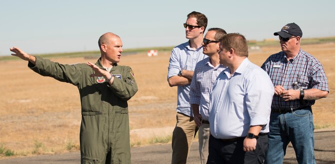 Lt. Col. Dean Berck, 366th Operational Support Squadron commander, briefs congressional advisors about Gunfighter Flag at Mountain Home Air Force Base, Idaho, July 19, 2016.  Gunfighter Flag is a quarterly training exercise hosted by the 366th Fighter Wing in order to enhance and maintain combat readiness. (U.S. Air Force photo by Airman Alaysia Berry/Released)