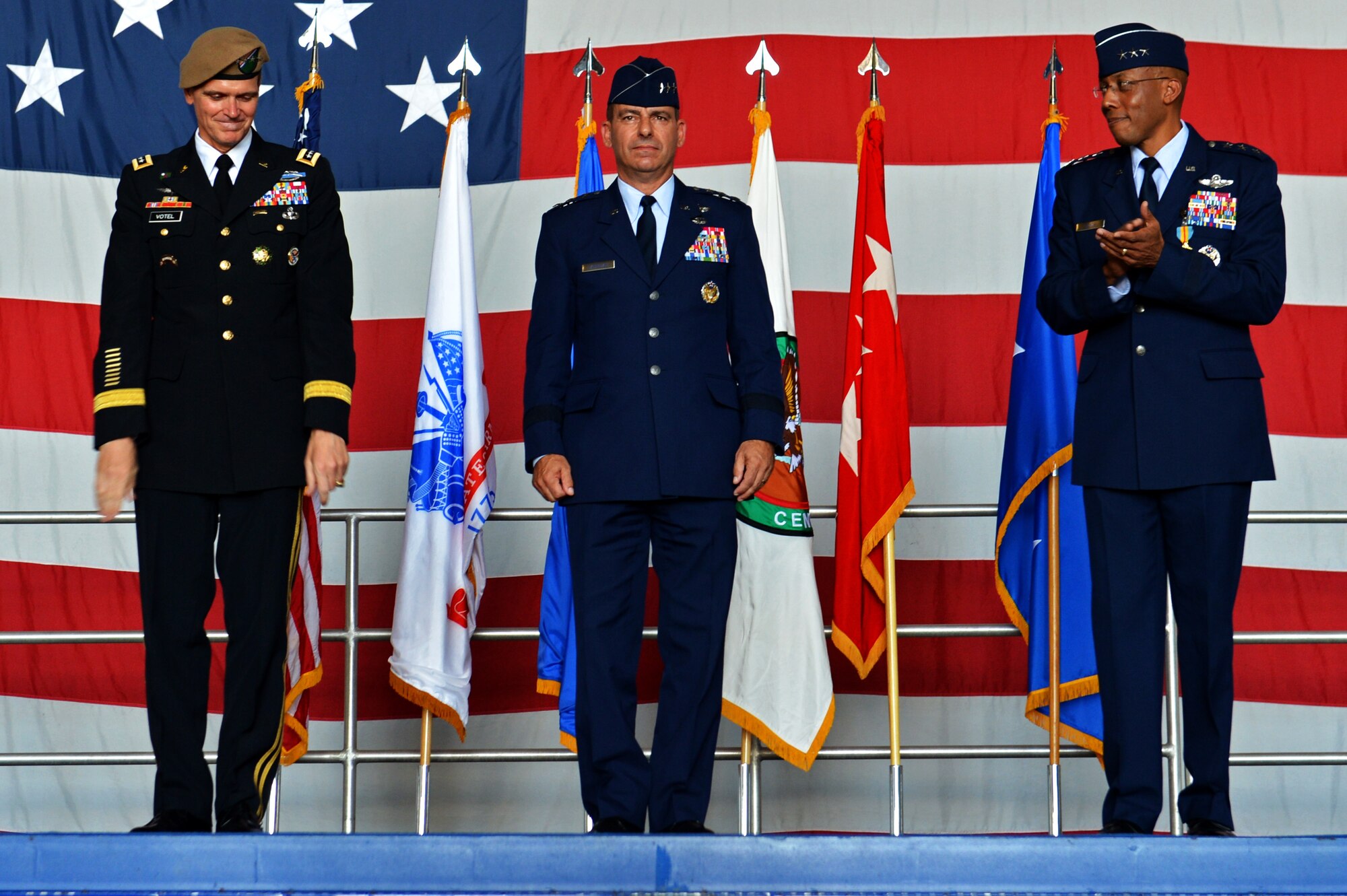U.S. Army Gen. Joseph L. Votel, U.S. Central Command commander, stands with U.S. Air Force Lt. Gen. Jeffrey L. Harrigian., U.S. Air Forces Central Command commander, and  U.S. Air Force Lt. Gen. Charles Q. Brown Jr., U.S. Air Forces Central Command outgoing commander, during a change of command ceremony at Shaw Air Force Base, S.C., July 22, 2016. Outgoing and incoming commanders exchange a unit’s guidon to symbolize relinquishment and assumption of command. (U.S. Air Force photo by Airman 1st Class Christopher Maldonado/Released)
