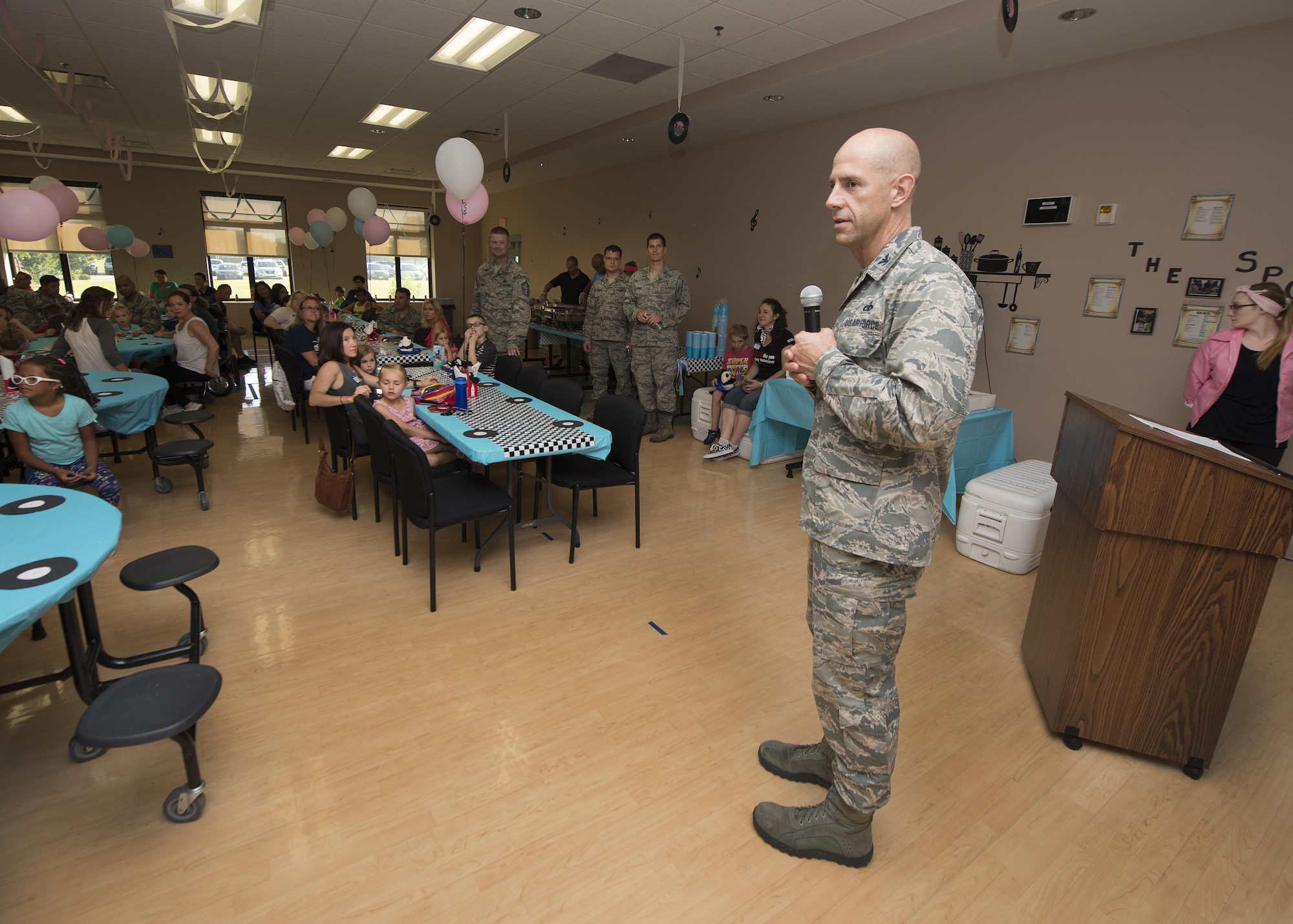 Col. Tyler Knack, 436th Maintenance Group commander, delivers opening remarks at the Summer Deployed Families Dinner July 21, 2016, at the Youth Center on Dover Air Force Base, Del. The dinner, held quarterly, was organized by the 436th MXG. (U.S. Air Force photo/Senior Airman Zachary Cacicia)
