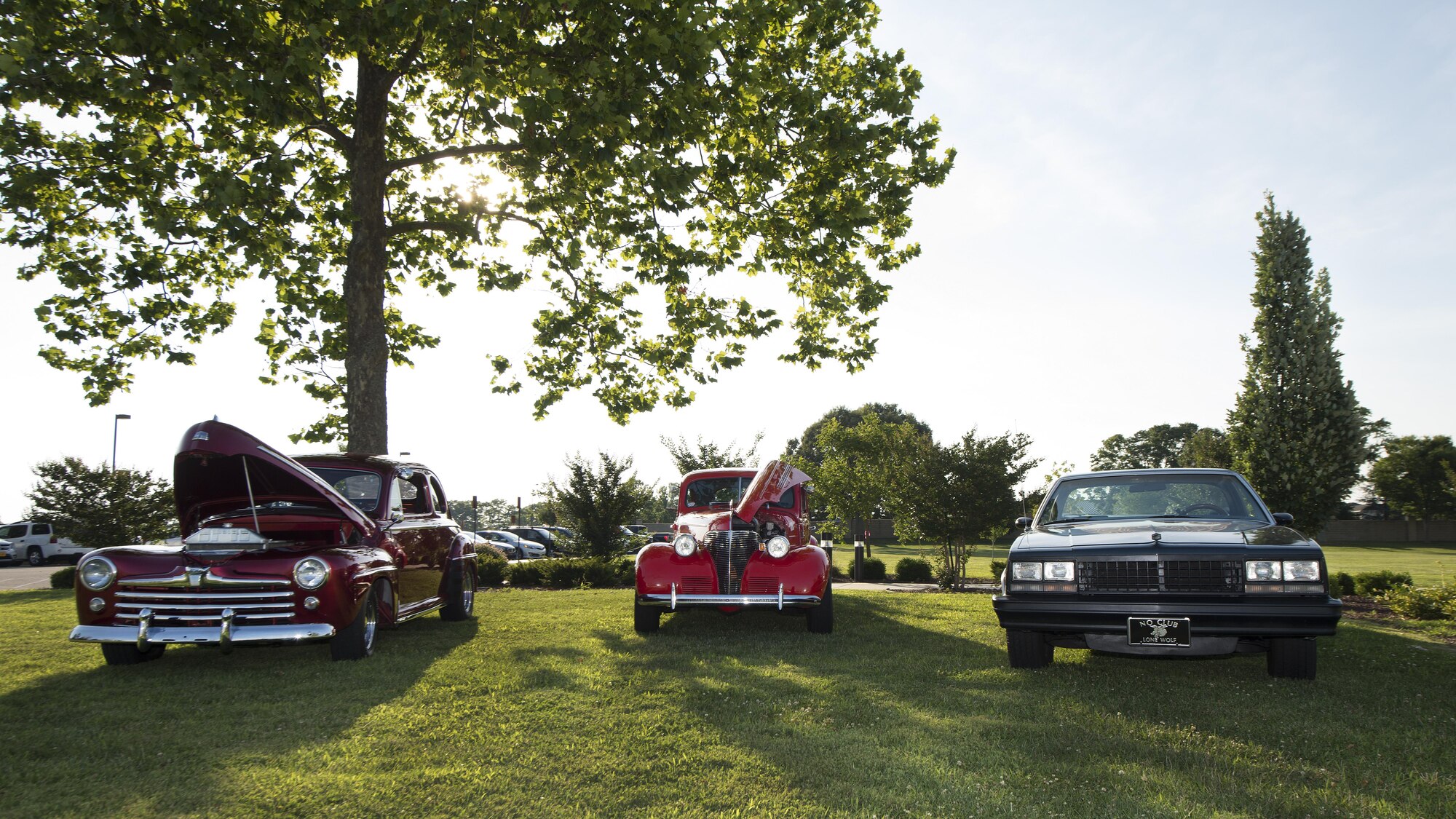 Classic hot-rods sit outside the Youth Center during the Summer Deployed Families Dinner July 21, 2016, on Dover Air Force Base, Del. A total of five cars were on display. (U.S. Air Force photo/Senior Airman Zachary Cacicia)
