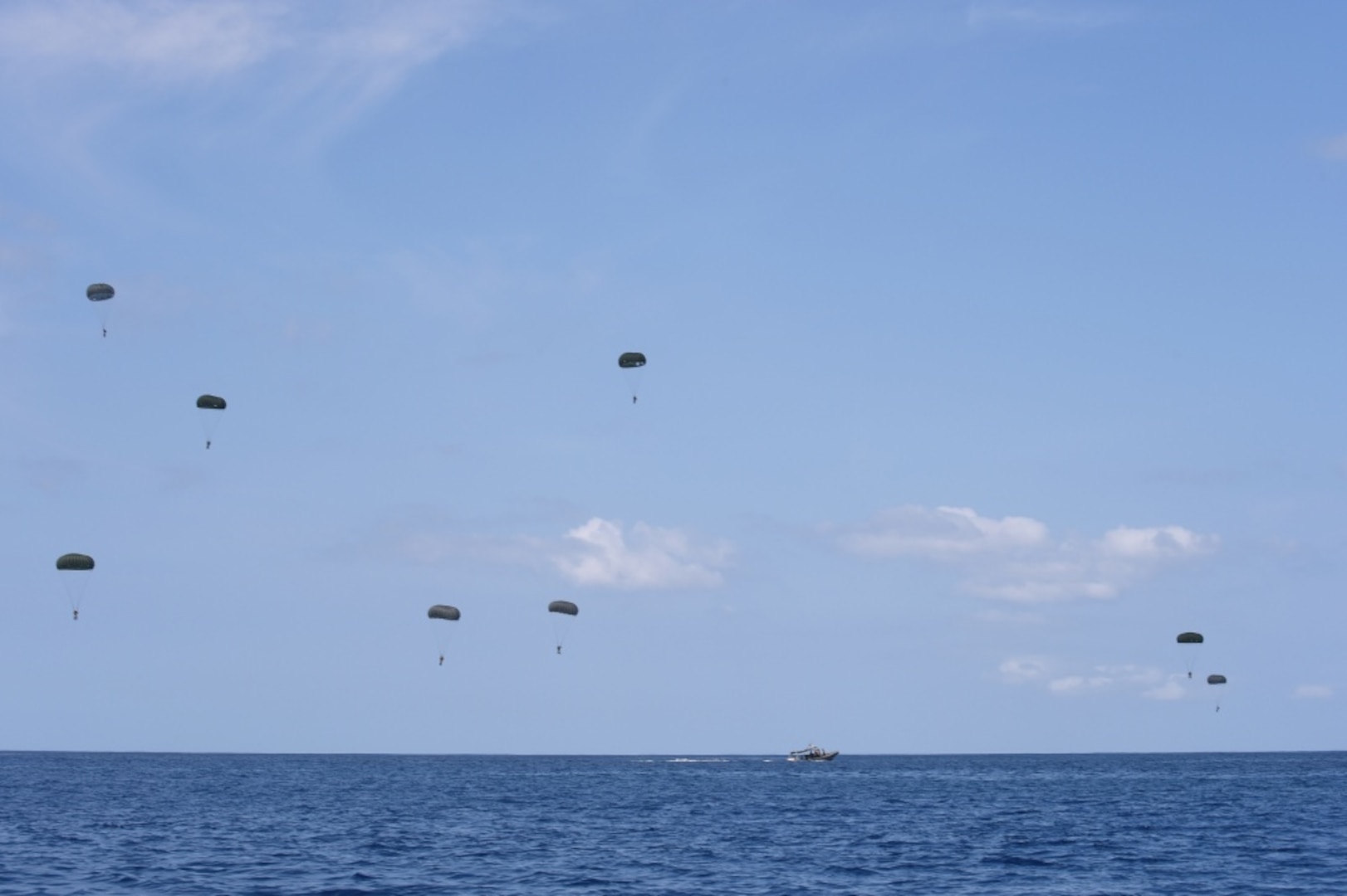 (July 20, 2016) - Paratroopers assigned to the 1st Battalion, 1st Special Forces Group (Airborne) conduct a water jump off the eastern coast of Oahu during Rim of the Pacific 2016. Twenty-six nations, more than 40 ships and submarines, more than 200 aircraft, and 25,000 personnel are participating in RIMPAC from June 30 to Aug. 4, in and around the Hawaiian Islands and Southern California. The world's largest international maritime exercise, RIMPAC provides a unique training opportunity that helps participants foster and sustain the cooperative relationships that are critical to ensuring the safety of sea lanes and security on the world's oceans. RIMPAC 2016 is the 25th exercise in the series that began in 1971. 