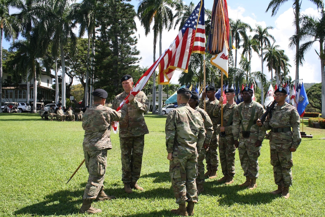 Col. Peter B. Andrysiak (r) receives the Army Colors from Lt. Gen. Todd T. Semonite during a Change-of-Command ceremony July 12, on Palm Circle, Fort Shafter. Andrysiak became the 32nd commander of the Pacific Ocean Division, U.S. Army Corps of Engineers. 