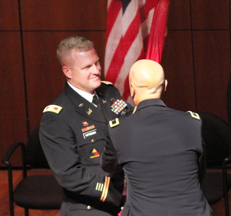 Colonel Douglas B. Guttormsen accepts the guidon of the Kansas City District from USACE Northwestern Division Commander Brig. Gen. Scott A. Spellmon in a Change of Command ceremony July 22, 2016 at the National World War I Museum and Memoria