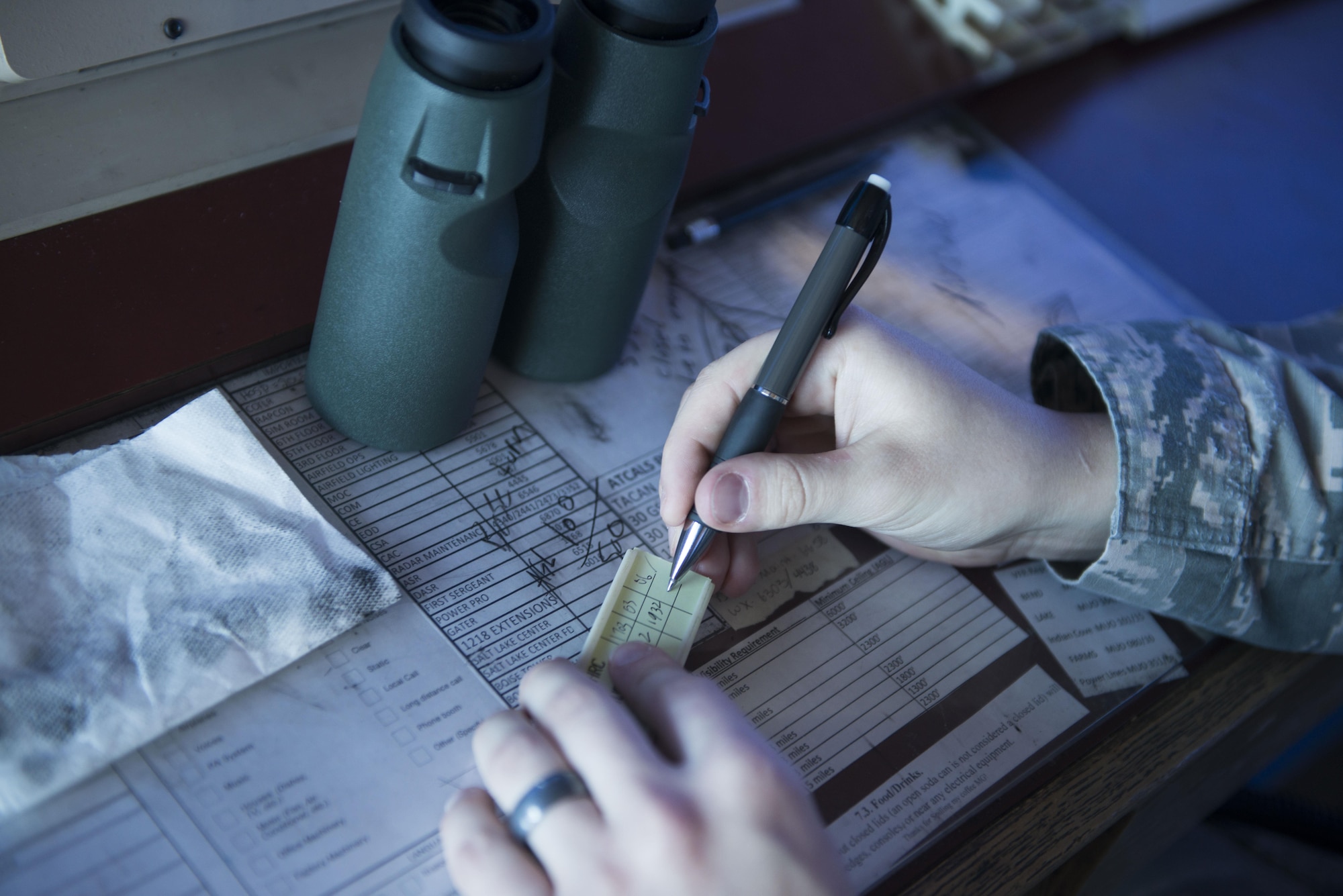 Airman 1st Class Bobby Bell, 366th Operation Support Squadron air traffic controller, writes information he received, July 21, 2016, at Mountain Home Air Force Base, Idaho. Air Traffic Controllers played a vital role, controlling all aircraft taking off and landing for Gunfighter Flag 16-3. (U.S. Air Force photo by Senior Airman Malissa Lott/RELEASED)