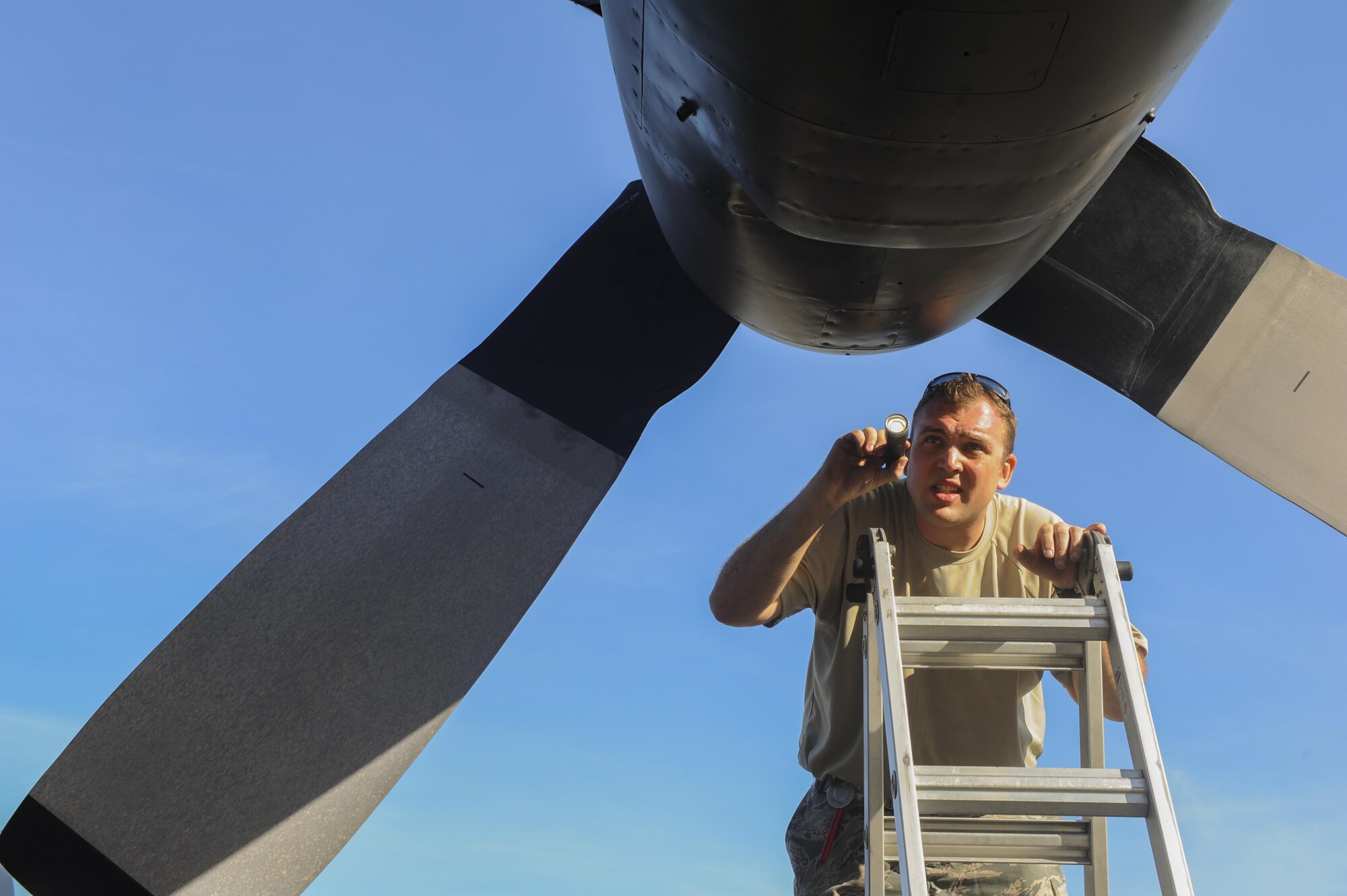 Staff Sgt. Christopher Dawson, a crew chief assigned to the 901st Special Operations Aircraft Maintenance Squadron, fixes a propeller on a MC-130H Combat Talon II aircraft at Hurlburt Field, Fla., July 20, 2016. The MC-130H is equipped with aerial refueling pods to provide in-flight refueling. (U.S. Air Force photo by Airman 1st Class Isaac O. Guest)
