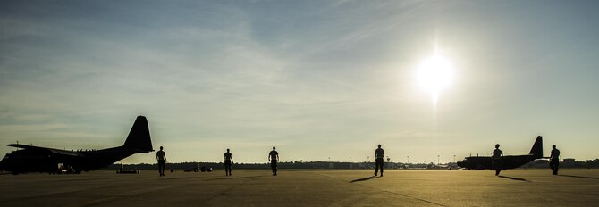 Air Commandos from the 15th Aircraft Maintenance Unit perform a foreign object damage walk at Hurlburt Field, Fla., July 20, 2016. During a F.O.D. walk, Airmen spread out and pick up any loose objects they see that could damage the aircraft. (U.S. Air Force photo by Airman 1st Class Isaac O. Guest)
