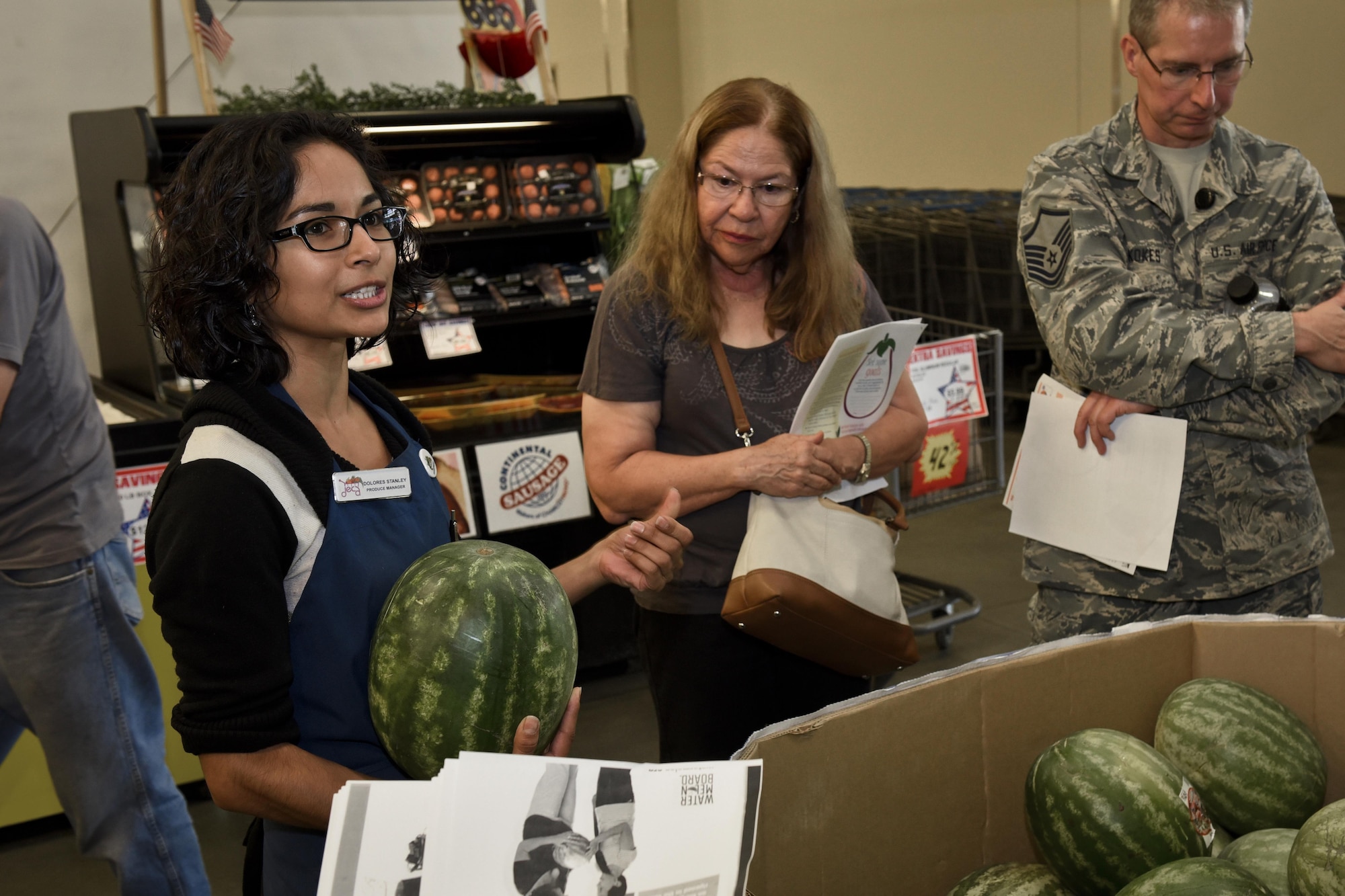 PETERSON AIR FORCE BASE, Colo. – Delores Stanley, Peterson Commissary produce manager, educates Team Pete members about the qualities to look for in fresh produce during the Fruits and Veggies – Eat More Tour at the commissary on Peterson Air Force Base, Colo., July 21, 2016. The goal of the tour was to provide a new source for healthy living tips to anyone with Peterson access. (U.S. Air Force photo by Senior Airman Rose Gudex)