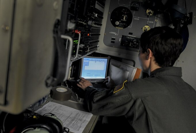 Senior Airmen Ashley Igalo, 437th Airlift Wing, Joint Base Charleston, S.C., loadmaster, prepares the cargo area of a C-17 for take-off during Red Flag 16-3 at Nellis Air Force Base, Nev., July 20, 2016. Night missions have been integrated into Red Flag to prepare aircrew for missions in low-light environments. (U.S. Air Force photo by Airman 1st Class Kevin Tanenbaum/Released)