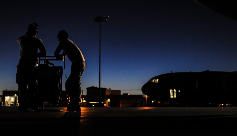 Staff Sgt. Austin Overbaugh, 437th Aircraft Maintenance Squadron, Joint Base Charleston, S.C., aerospace propulsion maintainer, and Staff Sgt. Adrian Rincones, 437th AMXS crew chief prepare a C-17 for take-off during Red Flag 16-3 at Nellis Air Force Base, Nev., July 20, 2016. Red Flag enhances aircrew’s combat readiness and survivability by challenging them with realistic combat scenarios. (U.S. Air Force photo by Airman 1st Class Kevin Tanenbaum/Released)