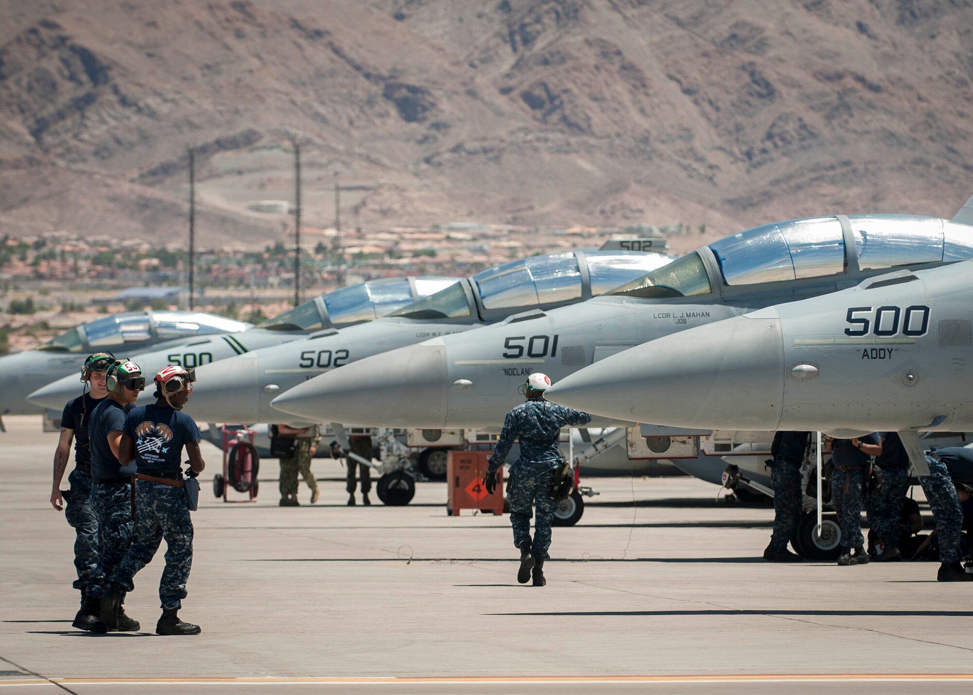Navy personnel from the Electronic Attack Squadron-139 perform maintenance checks before a training sortie during Red Flag 16-3 July 14. Red Flag 16-3 is a three week exercise that will integrate members from Air Force, Navy and Marines to train in Air, Space and Cyberspace. (U.S. Air Force photo by Senior Airman Jake Carter)