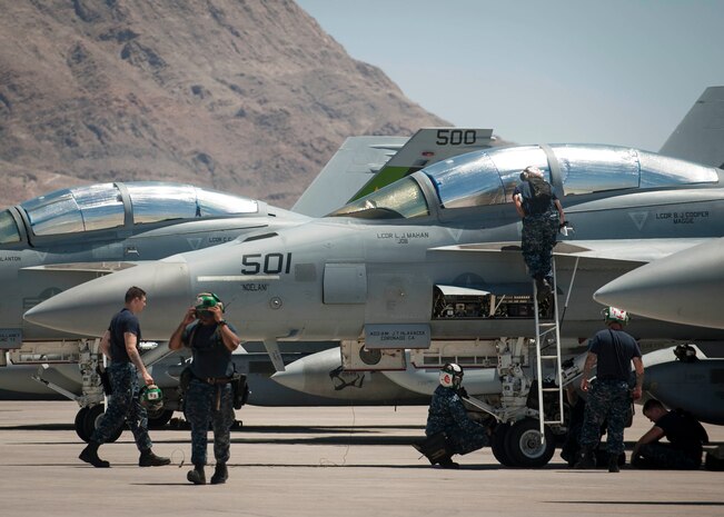 Navy personnel from the Electronic Attack Squadron-139 perform maintenance checks before a training sortie during Red Flag 16-3 July 14. During the exercise, integration of Air Force, Marines and Navy aircraft work together during Red Flag 16-3 to deter air and ground threats as well as prepare for future operations down range. (U.S. Air Force photo by Senior Airman Jake Carter)