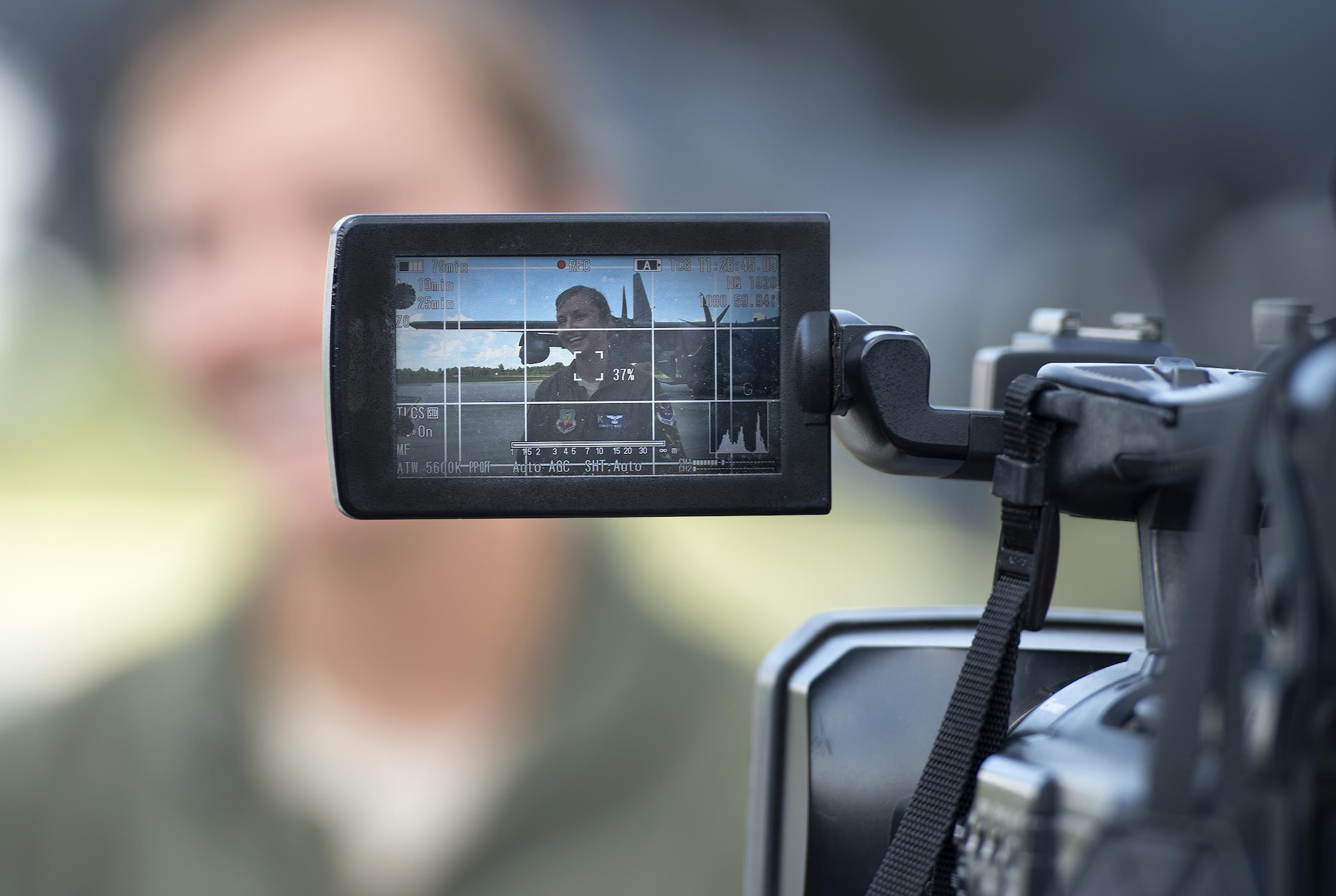 A local media news outlet interviews U.S. Air Force Capt. Christy Wise, 71st Rescue Squadron HC-130J Combat King II pilot, after her requalification flight, July 22, 2016, at Moody Air Force Base, Ga. Wise spent 15 months after her accident rehabilitating in preparation for her return to flight. (U.S. Air Force photo by Airman 1st Class Janiqua P. Robinson)