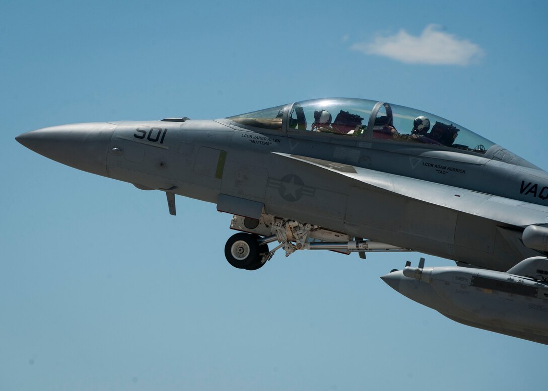 An Navy EA-18G from Naval Air Station Whidbey Island, Washington, takes off from the Nellis flightline during a training scenario during Red Flag 16-3 July 19, 2016. During the exercise, integration of Air Force, Marines and Navy aircraft work together during Red Flag 16-3 to deter air and ground threats as well as prepare for future operations down range. (U.S. Air Force photo by Senior Airman Jake Carter)