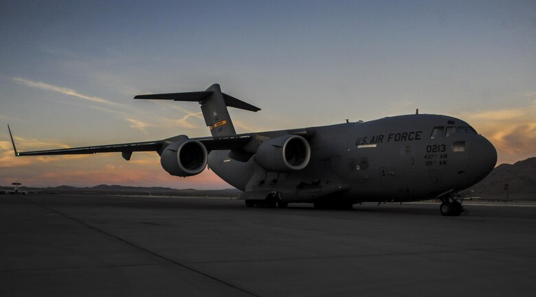 A C-17, assigned to the 437th Airlift Wing, Joint Base Charleston, S.C., sits on the runway before take-off during Red Flag 16-3 at Nellis Air Force Base, Nev., July 20, 2016. Red Flag provides an opportunity for aircrew and military aircraft to enhance their tactical operational skills alongside military aircraft from coalition forces. (U.S. Air Force photo by Airman 1st Class Kevin Tanenbaum/Released)