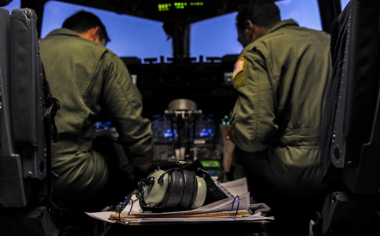 Capts. Scott Levin. Michael Sattes, 437th Airlift Wing, Joint Base Charleston, S.C., pilots, Joint Base Charleston, prepare a C-17 for take-off during Red Flag 16-3 at Nellis Air Force Base, Nev., July 20, 2016. In addition to daytime operations, Red Flag conducts training exercises during hours of darkness to train for low visibility environment. (U.S. Air Force photo by Airman 1st Class Kevin Tanenbaum/Released)