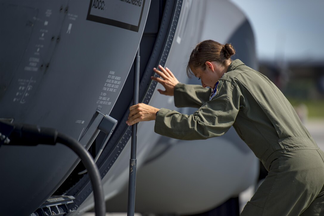 U.S. Air Force Capt. Christy Wise, 71st Rescue Squadron pilot, climbs into an HC-130J Combat King II for her first flight since becoming an above-the-knee amputee, July 22, 2016, at Moody Air Force Base, Ga. Wise underwent nearly 15 months of rehabilitation before she was cleared to fly. (U.S. Air Force Photo by Senior Airman Ryan Callaghan)
