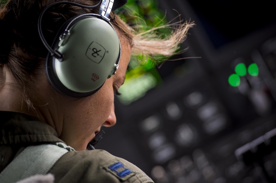 U.S. Air Force Capt. Christy Wise, 71st Rescue Squadron HC-130 J Combat King II pilot, looks over flight plans prior to her first flight since becoming an above-the-knee amputee, July 22, 2016, at Moody Air Force Base, Ga. Wise says her goal from day one after the accident was to return to the cockpit. (U.S. Air Force Photo by Senior Airman Ryan Callaghan)
