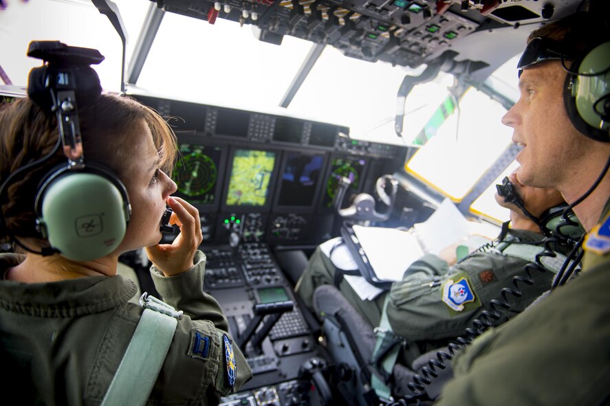 U.S. Air Force Capt. Christy Wise, left, 71st Rescue Squadron HC-130J Combat King II pilot, talks with co-pilots prior to her first flight back in the cockpit, July 22, 2016, at Moody Air Force Base, Ga. Wise is the fourth above-the-knee amputee pilot to return to flying status. (U.S. Air Force Photo by Senior Airman Ryan Callaghan)
