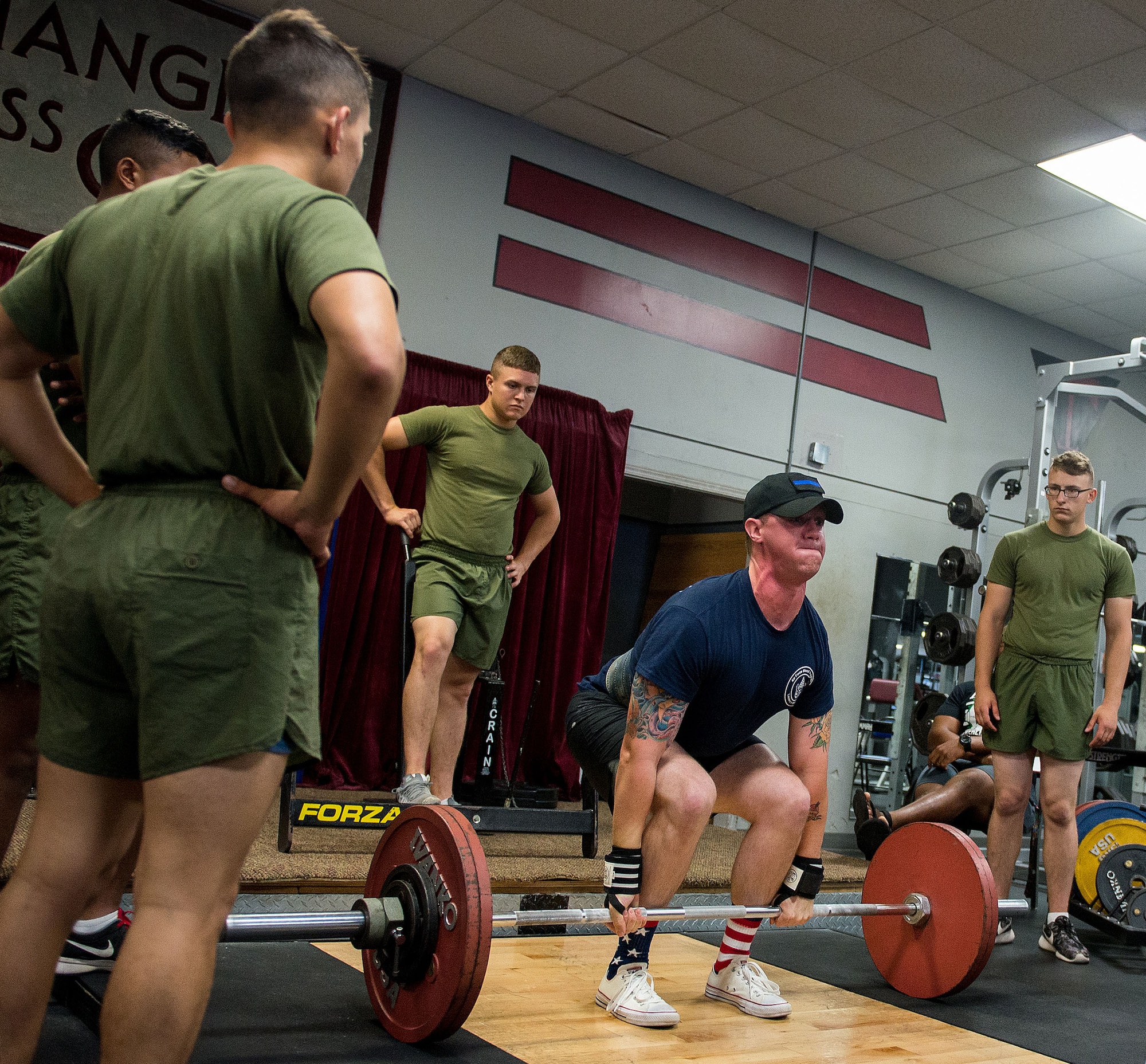Airman 1st Class Douglas Ellison, 338th Training Squadron student, performs a deadlift during the annual Muscle Mania event at the Triangle Fitness Center July 16, 2016, on Keesler Air Force Base, Miss. The powerlifting event was open to men and women and featured squat, deadlift and bench press categories. (U.S. Air Force photo by Marie Floyd/Released) 