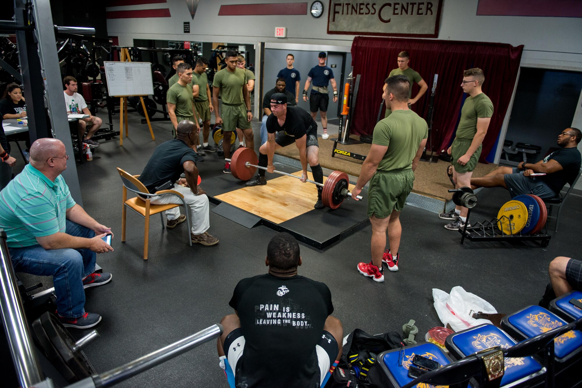 Airman 1st Class Raymond Carney, 336th Training Squadron student, performs a deadlift during the annual Muscle Mania event at the Triangle Fitness Center July 16, 2016, on Keesler Air Force Base, Miss. The powerlifting event was open to men and women and featured squat, deadlift and bench press categories. (U.S. Air Force photo by Marie Floyd/Released)