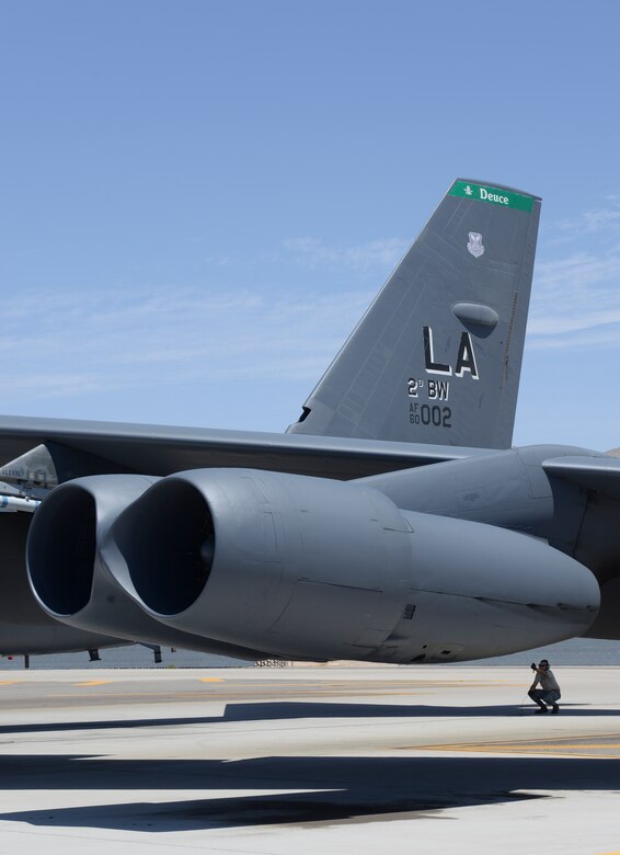 Senior Airman Elias Sapp, 96th Bomb Squadron crew chief, prepares a B-52 Stratofortress for takeoff during Red Flag 16-3 at Nellis Air Force Base, Nev., July 18, 2016. All four branches of the U.S. military participate in Red Flag at Nellis AFB to help familiarize forces to work together in future operations. (U.S. Air Force photo by Senior Airman Kristin High/Released)