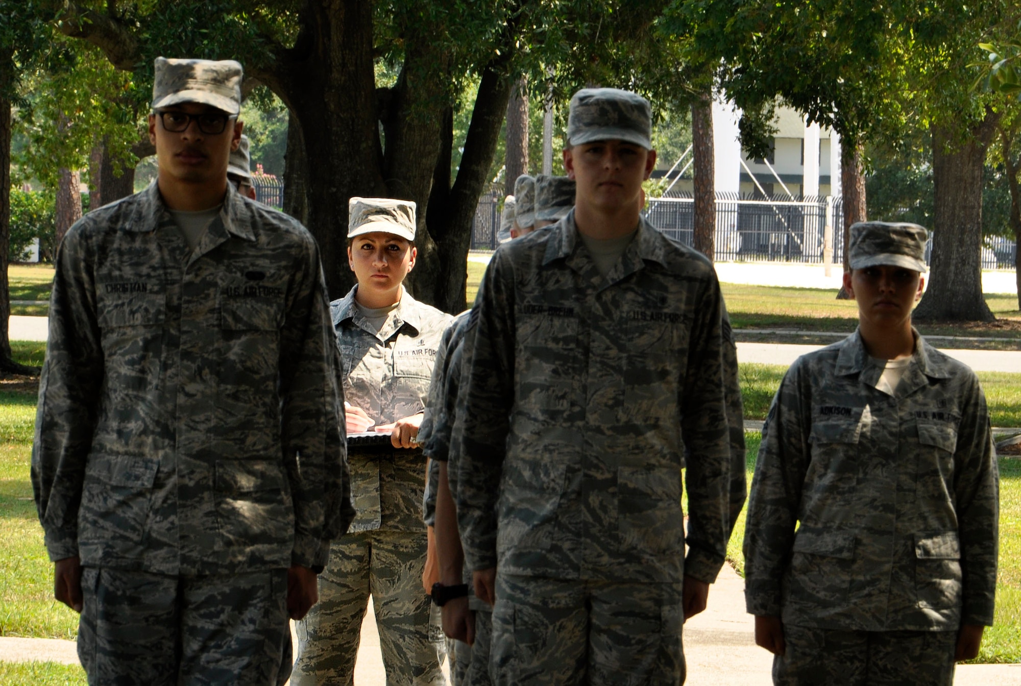 Tech. Sgt. Cassandra Cruz, 81st Force Support Squadron Airman Leadership School instructor grades a flight during their drill practice at the ALS building, July 21, 2016, on Keesler Air Force Base, Miss. Cruz was selected as one of this year’s 12 Outstanding Airmen of the Year. Volunteers assisted in providing staged photos of Cruz on the job for display in the Pentagon. (U.S. Air Force photo by Tech. Sgt. Kimberly Rae Moore/Released)