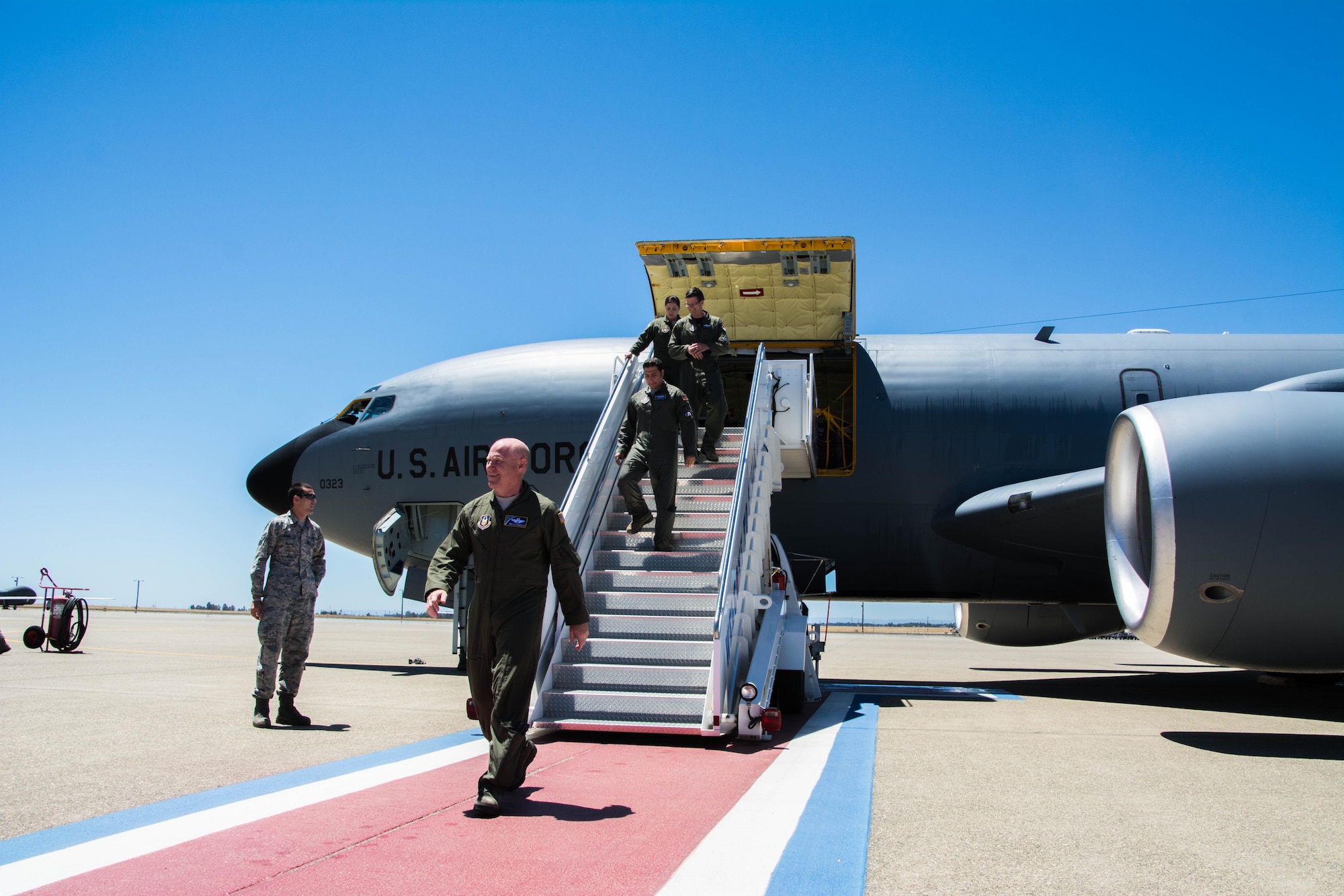 Col. Richard Heaslip, 940th Operations Group commander, along with his crew steps off the first of eight KC-135 Stratotankers to arrive at Beale Air Force Base, California on July 10, 2016. The 940th Air Refueling Wing was re-designated from the 940th Wing during an official ceremony on June 4, 2016. The seven remaining KC-135 aircraft are anticipated to arrive in the next coming months. (Courtesy photo by John L. Brackens)