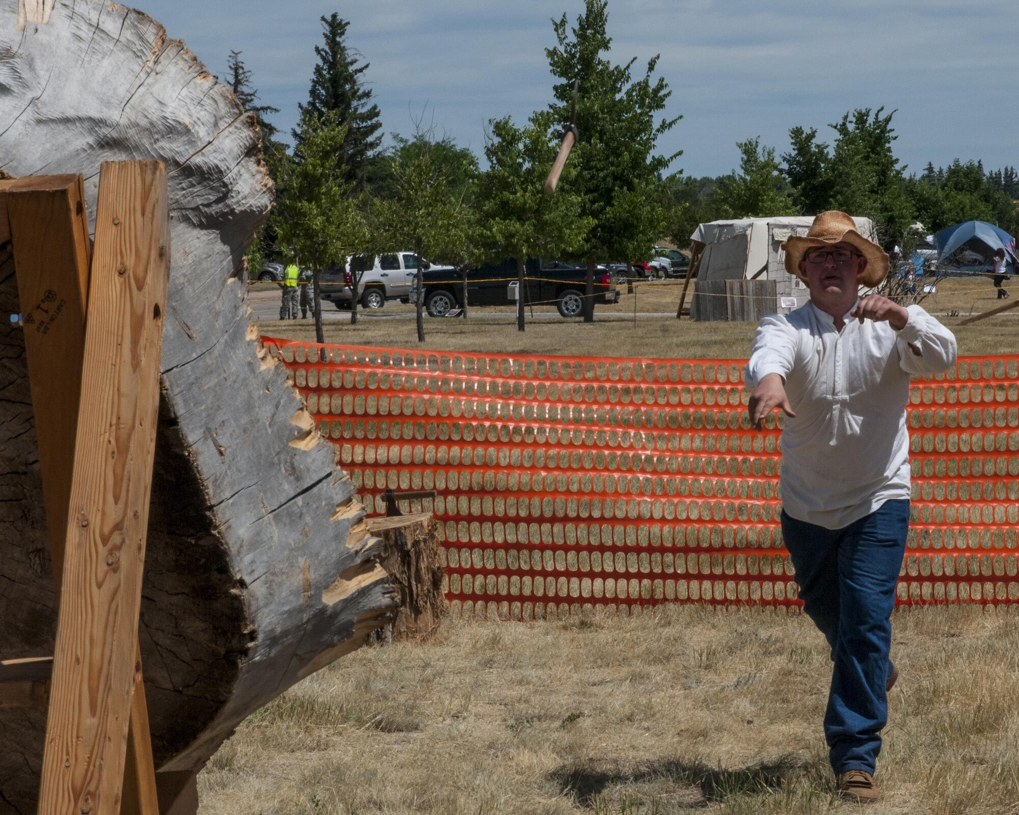 Danny DeChaney, volunteer, tosses a tomahawk at a target July 22, 2016, during Fort D.A. Russell Days, the annual F.E. Warren Air Force Base, Wyo., open house. The open house displays the Mighty Ninety mission and history of the base. (U.S. Air Force photo by Senior Airman Jason Wiese)