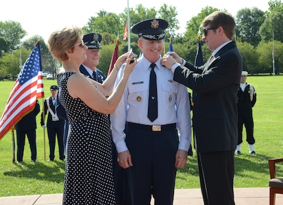 Nancy Wilson and Sterling Wilson pin a fourth star onto the uniform epaulets of U.S. Air Force Gen. Stephen W. Wilson, U.S. Strategic Command (USSTRATCOM) deputy commander, as U.S. Air Force Gen. David L. Goldfein, U.S. Air Force chief of staff, looks on during Wilsonâ€™s promotion ceremony at Offutt Air Force Base, Neb., July 22, 2016. Goldfein, who presided over the ceremony, noted that Wilson had the competence and character required to be promoted to the rank of general and hold the position of 39th vice chief of staff of the U.S. Air Force. Wilson, a command pilot with more than 4,500 flying hours and 680 combat hours, has been at USSTRATCOM since July 2015. He previously served as the Air Force Global Strike Command commander. One of nine DoD unified combatant commands, USSTRATCOM has global strategic missions assigned through the Unified Command Plan, which include strategic deterrence; space operations; cyberspace operations; joint electronic warfare; global strike; missile defense; intelligence, surveillance and reconnaissance; combating weapons of mass destruction; and analysis and targeting. (USSTRATCOM photo by Master Sgt. April Wickes)