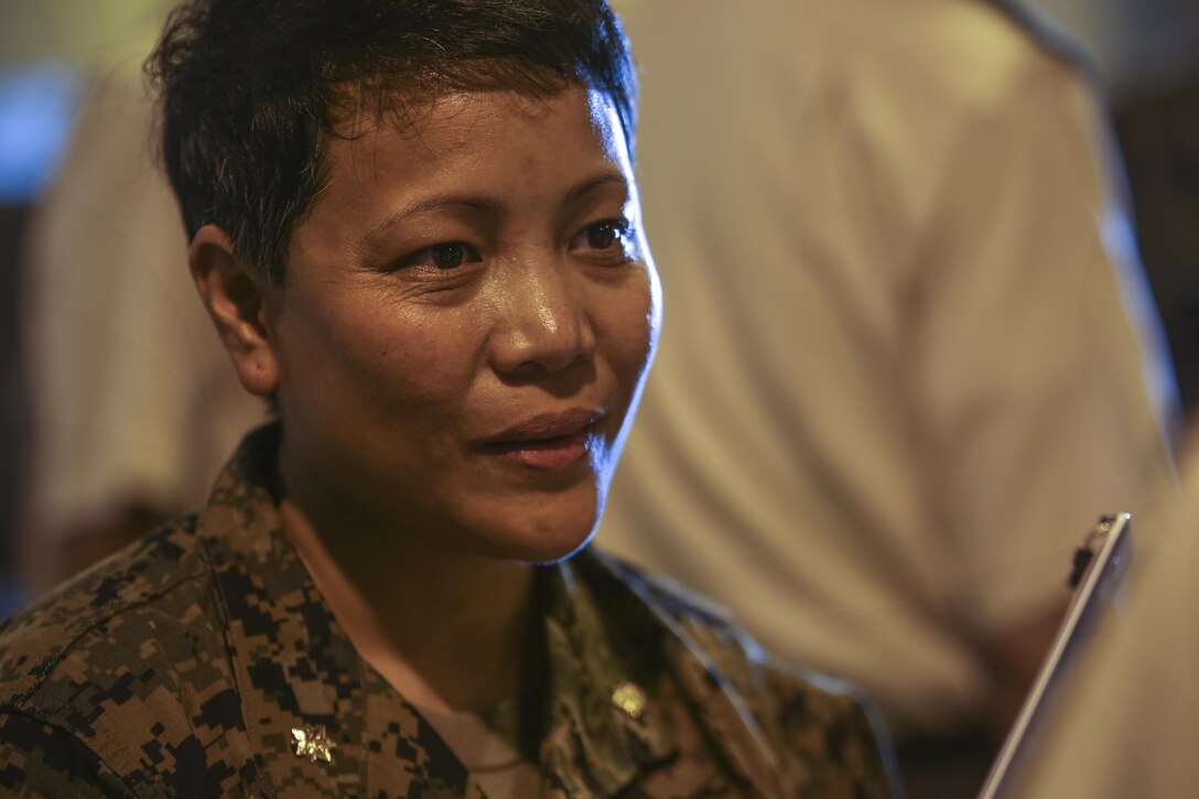 U.S. Navy Lt. Cmdr. Lorelie Flinn lectures Japanese Ground Self Defense Force officers at Camp Kinser, Okinawa, Japan, July 20, 2016. Japanese Ground Self Defense Force officers observed how U.S. Sailors would use a mobile operating room so that they can take care of personnel at the sight of injury. Flinn, from the Philippines, is company commander for 3rd Medical Battalion, 3rd Marine Logistics Group, III Marine Expeditionary Force. (U.S. Marine Corps photo by Lance Cpl. Nelson Duenas/ Released)
